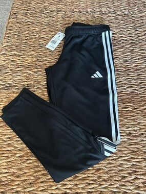 adidas Black Soccer Pants with White Side Stripes and Ankle Zipper.